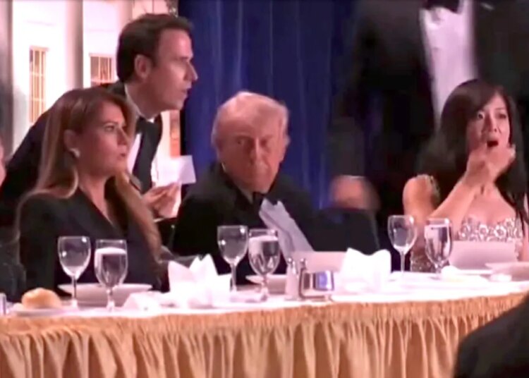 First lady Melania Trump and President Donald Trump react to reports of shots fired at the annual White House Correspondents Dinner at the Washington Hilton, Saturday, March 25, 2026, in Washington.