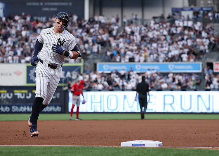 NEW YORK, NEW YORK - APRIL 15: Aaron Judge #99 of the New York Yankees rounds the bases after hitting a solo home run during the first inning of the game against the Los Angeles Angels at Yankee Stadium on April 15, 2026 in New York City. All players are wearing the number 42 in honor of Jackie Robinson Day. (Photo by Dustin Satloff/Getty Images)