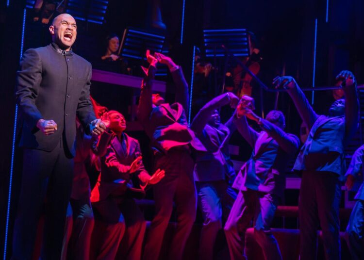 Nicholas Christopher (as Anatoly Sergievksy) and the cast of "Chess."