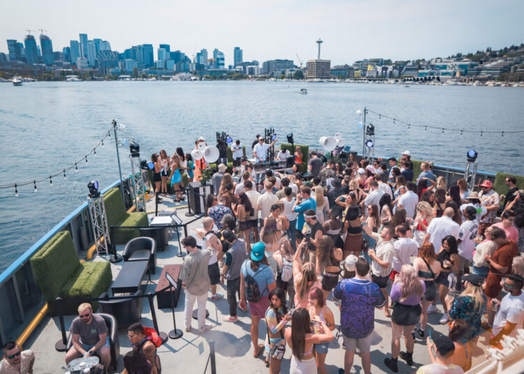 Soundwavs on the Hiyu with Seattle Skyline in background