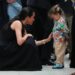 Meghan Markle meets a young child during a visit to the Royal Children's Hospital Melbourne.