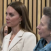 The Princess of Wales and the Princess Royal listen to a midwife