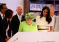 Queen Elizabeth II and Meghan Markle visit Chester Storyhouse in 2018. By: MEGA