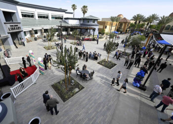 Visitors gather during the official opening of the newly redesigned...