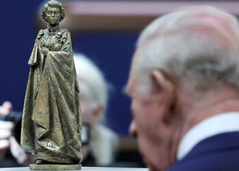 King Charles III views a scaled model of a statue of Queen Elizabeth by sculptor Martin Jennings, during a visit to the British Museum in central London on April 21, 2026. The statue will be part of a memorial to the late monarch.