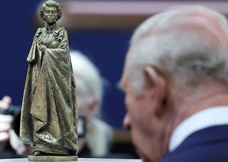King Charles III views a scaled model of a statue of Queen Elizabeth by sculptor Martin Jennings, during a visit to the British Museum in central London on April 21, 2026. The statue will be part of a memorial to the late monarch.