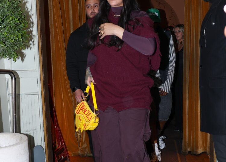 Rihanna&nbsp;and A$AP Rocky are spotted leaving Siena restaurant in Paris, France, with Rihanna carrying a sold-out Dior saddle bag featuring a bright yellow Dracula design
