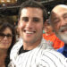 Jake Reiner, Michele, and Rob posing for a photo at a baseball game.