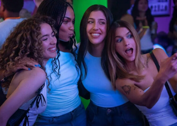 The four girl group takes a picture together.