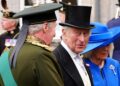 King Charles III smiles during a garden party at the Palace of Holyroodhouse in Edinburgh, Scotland, on July 1, 2025, on the first day of the king and queen's visit to Scotland.