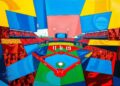 A cubist-style painting featuring overlapping geometric shapes and planes of bright blue, red, and yellow, conceptually representing the disruption and fragmentation caused by a last-minute lineup change in a baseball game.