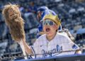 A young fan cheers while watching Kansas City Royals first baseman Vinnie Pasquantino (9) during batting practice before the home opener against the Minnesota Twins at Kauffman Stadium on Monday, March 30, 2026, in Kansas City.