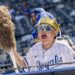 A young fan cheers while watching Kansas City Royals first baseman Vinnie Pasquantino (9) during batting practice before the home opener against the Minnesota Twins at Kauffman Stadium on Monday, March 30, 2026, in Kansas City.