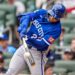 Kansas City Royals catcher Carter Jensen (22) swings at a pitch.