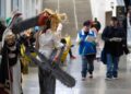 Kenny Mackey, dressed as a character from the Chainsaw Man manga series, stands with Grayson Quinn, wearing a costume from Honkai: Star Rail video game, attend SacAnime on Saturday, Jan. 4, 2025, at the Sacramento convention center.