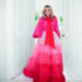 Sara Davies in a red ombre dress with ruffles