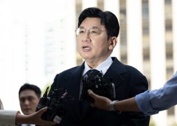 South Korean police seek to arrest K-pop mogul behind BTS