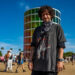 Jesse Kardon, known professionally as Subtronics, poses for a photo in front of the famed Spectra tower during Weekend 2 of the Coachella Valley Music and Arts Festival in Indio, Calif., Sunday, April 19, 2026.