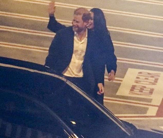 Meghan Markle waves and Prince Harry smiles as they land in Sydney