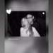 Social media post featuring a black-and-white photo of a woman and a man.