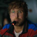 Ryan Gosling at a microphone in Project Hail Mary.