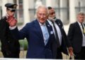 Photo shows King Charles III, a member of the British royal family, waving during an engagement in Rome, Italy. The royal family recently served a meat-free state banquet while hosting the president and first lady of Nigeria.