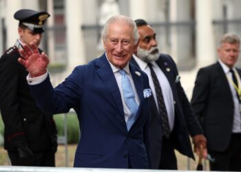 Photo shows King Charles III, a member of the British royal family, waving during an engagement in Rome, Italy. The royal family recently served a meat-free state banquet while hosting the president and first lady of Nigeria.