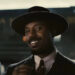 Michael B. Jordan smiling in Sinners.