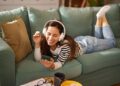 WOMAN LISTENING TO MUSIC ON COUCH