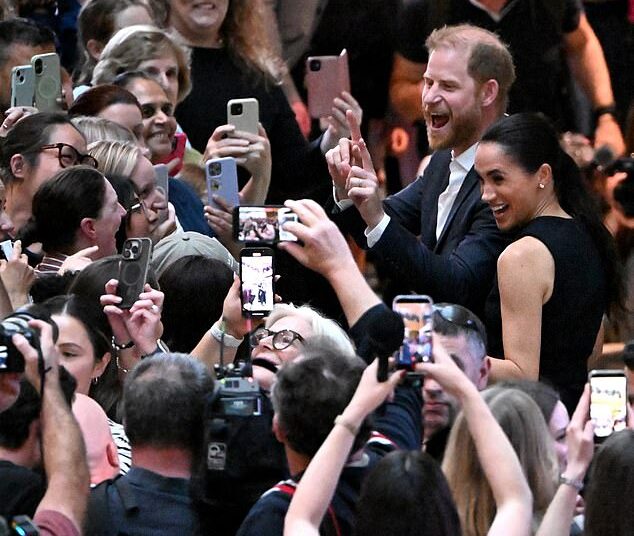 Prince Harry, Duke of Sussex, and his wife Meghan, Duchess of Sussex, meet people at the Royal Children's Hospital in Melbourne on April 14