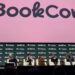Panel discussion at BookCon featuring multiple speakers.
