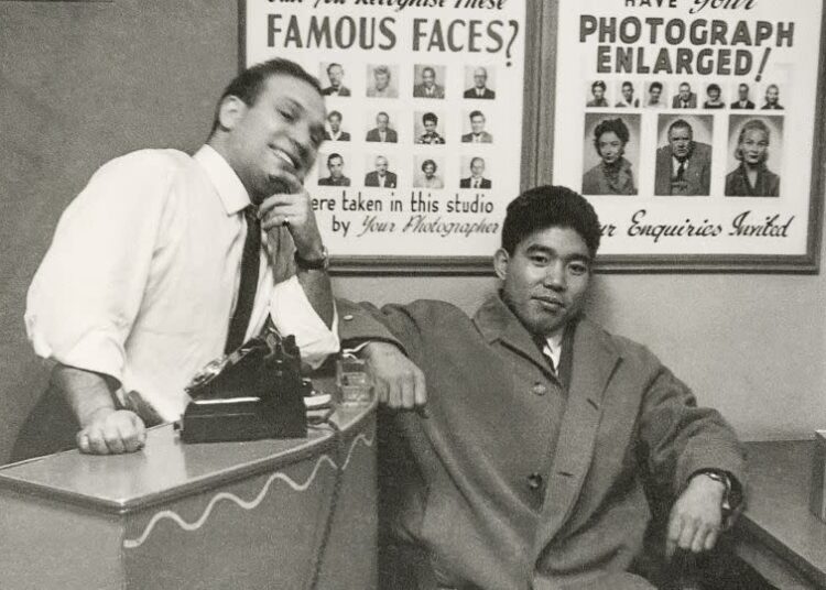 Dave Sharkey with a customer in 1962. The small shop featured its celebrity customers framed on the wall. - Courtesy Philip Sharkey