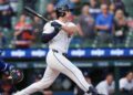 Tigers extend win streak to 6 by rallying in 9th for rain-delayed 10-9 victory over Royals