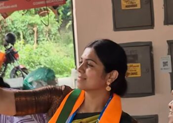 Anjali Nair taking a selfie during the campaign in Udayamperoor. Photo: Onmanorama
