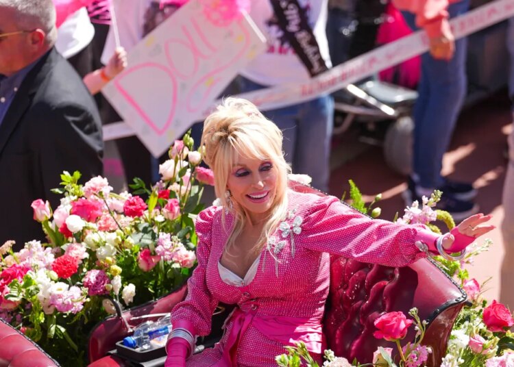 Who owns Dollywood? What is Dolly Parton's net worth?