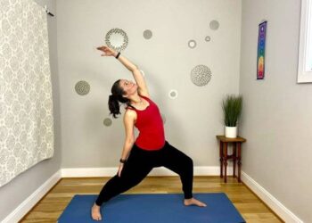 Lisa Jakub performing a yoga stretch