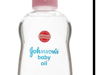 A tweet by Wizkid featuring a bottle of Johnson's baby oil with a pink cap.