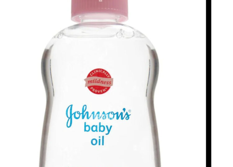 A tweet by Wizkid featuring a bottle of Johnson's baby oil with a pink cap.