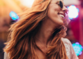 happy woman over forty dancing at music festival