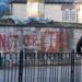 Graffiti saying 'Not Our King' is sprayed on a wall outside St Asaph Cathedral, where the King will later attend the annual Royal Maundy  Service