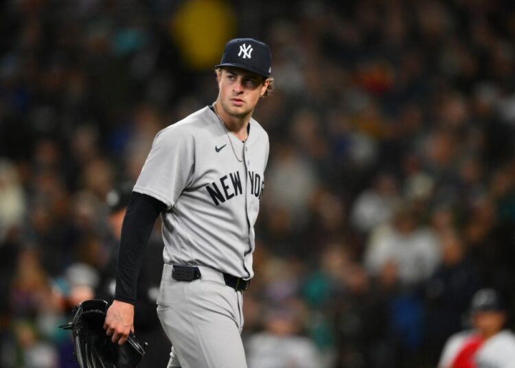 Cam Schlittler (31) walks off the field after being pulled from the game during the seventh inning against the Seattle Mariners at T-Mobile Park.