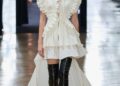 Runway model showcasing a modern, designer outfit