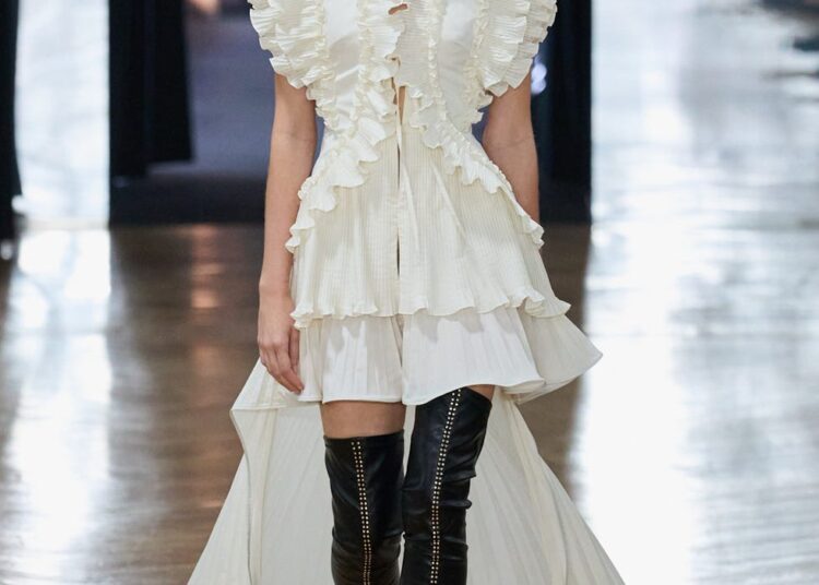 Runway model showcasing a modern, designer outfit