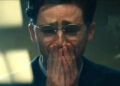 Timothee Chalamet crying with his hands on his mouth as Marty Mouser at the end of Marty Supreme .