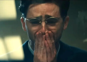 Timothee Chalamet crying with his hands on his mouth as Marty Mouser at the end of Marty Supreme .