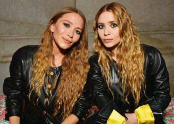 Mary-Kate and Ashley Olsen posing together at a public event