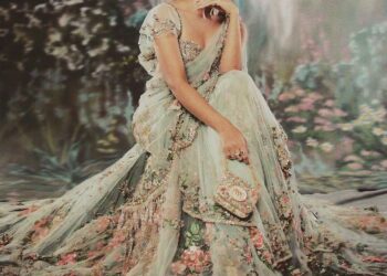 Alia Bhatt: At the Met Gala 2024, Alia Bhatt set the internet abuzz in a custom mint-green sari by Sabyasachi, complete with a dramatic 23-foot train. The ensemble featured intricate floral embroidery crafted with silk floss, glass beads, and semi-precious stones. She styled her hair in a loose updo, adorned with strands of gemstones that echoed the sari’s detailing, and finished the look with statement tourmaline-and-diamond earrings and stacked cocktail rings from Sabyasachi Accessories. (Image: Instagram)