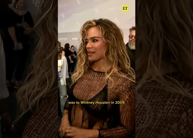 Karol G reacts to receiving the International Artist Award of Excellence at the #AMAs. #karolg
