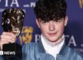 The cast and makers of Adolescence posing with their Bafta trophies
