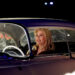 Geena Davis behind the wheel of a classic car as part of Sabrina Carpenter's Coachella set.